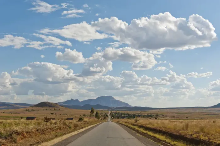 Framed Print : Long straight road, vast arid landscape, sky with clouds, Isalo National Park near Ranohira, Madagascar Framed Print : Long straight road, vast arid landscape, sky with clouds, Isalo National Park near Ranohira, Madagascar