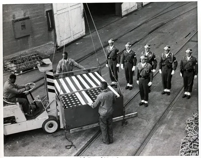 Framed Print : Longshoremen Place Forklift Under Casket