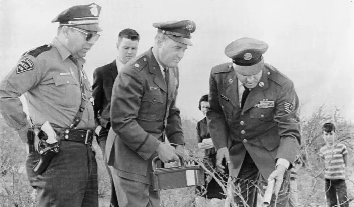 Framed Print : Lonnie Zamora Looks On As Major William Conner Uses A Geiger Counter Framed Print : Lonnie Zamora Looks On As Major William Conner Uses A Geiger Counter
