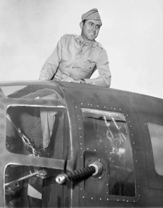 Framed Print : Lou Zamperini sitting climbing out of his bombardier hatch Framed Print : Lou Zamperini sitting climbing out of his bombardier hatch