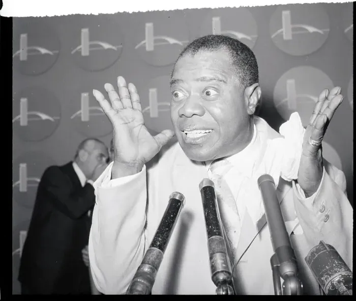Framed Print : Louis Armstrong Gestures Behind Microphone Framed Print : Louis Armstrong Gestures Behind Microphone