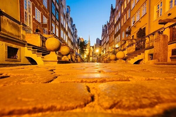 Low angle view St Marys Street (Ulica Mariacka) at dusk, Gdansk, Poland