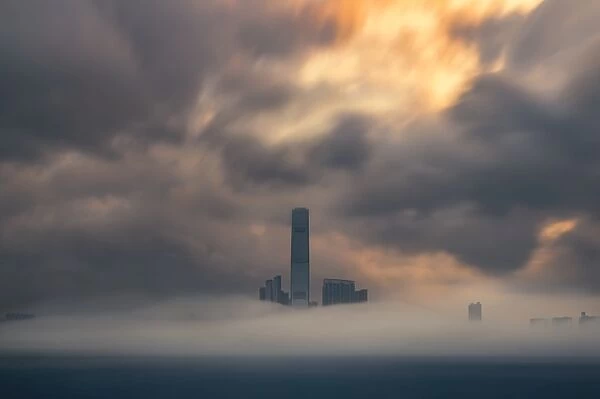 a low fog cover hong kong coastal skyline