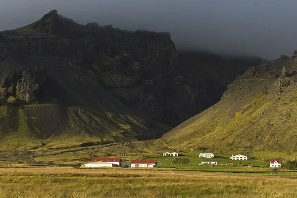 Low-hanging clouds, farmstead, near Skaftafell, South Coast, Iceland