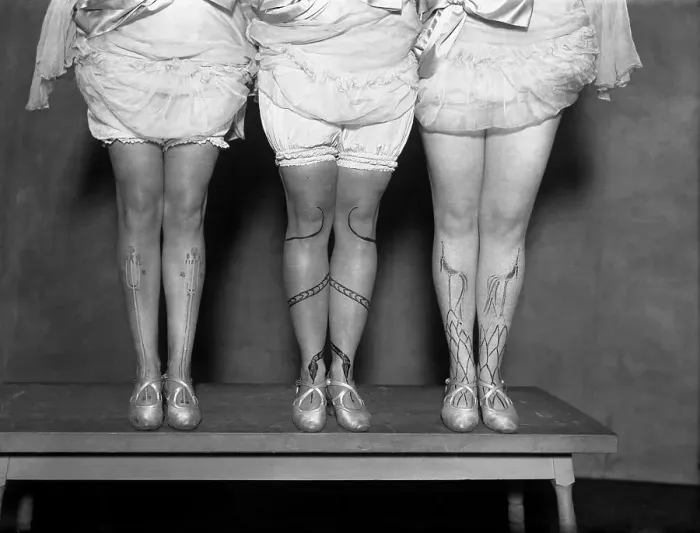 Framed Print : Low section of women with decoration on legs Framed Print : Low section of women with decoration on legs