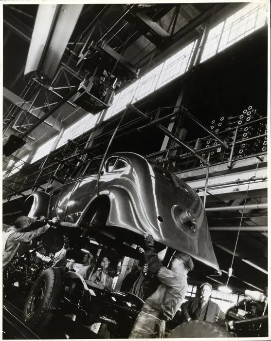 Framed Print : Lowering Auto Body Onto Chassis