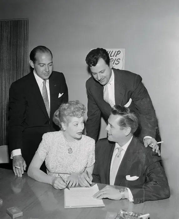 : Lucille Ball and Desi Arnaz Signing a Contract : Lucille Ball and Desi Arnaz Signing a Contract