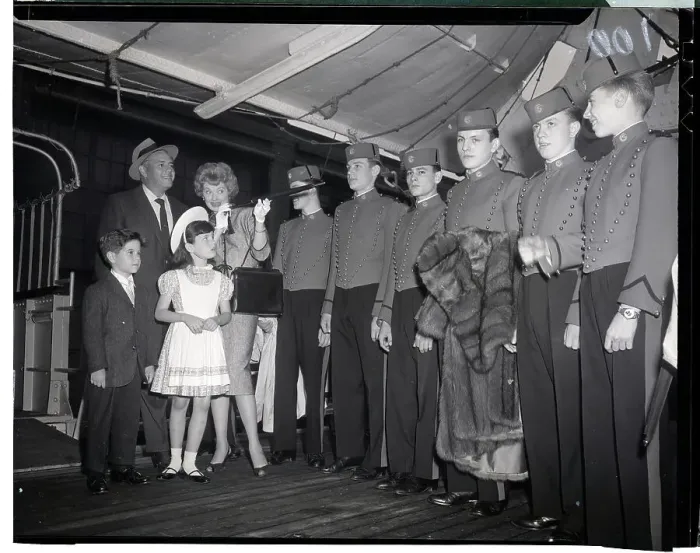 Framed Print : Lucille Ball and Family with Row of Bellhops Framed Print : Lucille Ball and Family with Row of Bellhops