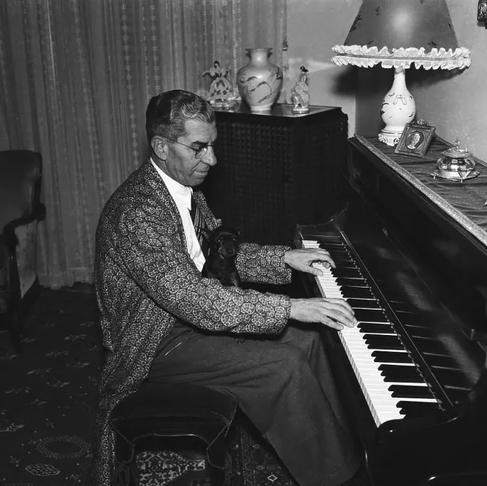 Framed Print : Lucky Luciano Playing Piano with Pet Dog Framed Print : Lucky Luciano Playing Piano with Pet Dog