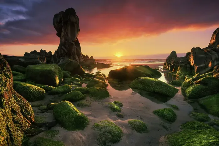 Framed Print : Lumeboo. A beautiful sunset at Lumeboo (or Lumebo) beach in Ferrol with many green rocks