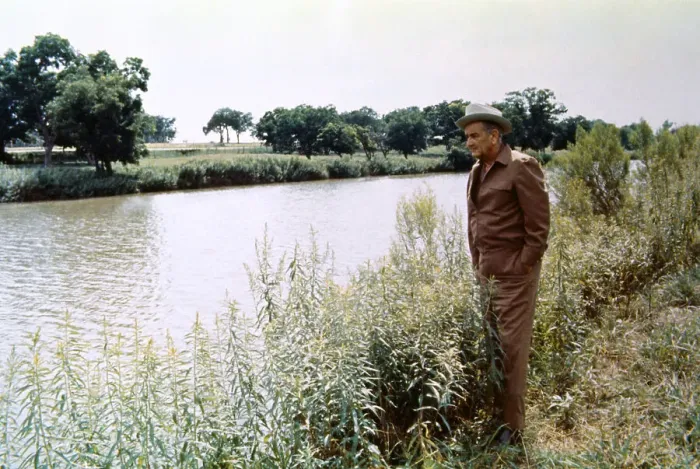 Framed Print : Lyndon B. Johnson Standing by Shoreline