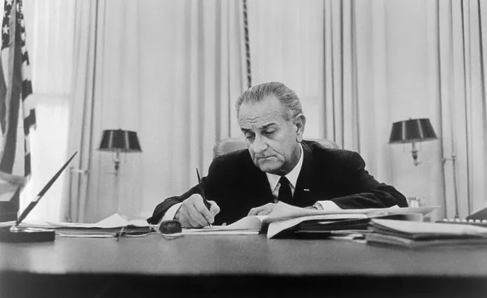 Framed Print : Lyndon Johnson Signing Paper at Desk Framed Print : Lyndon Johnson Signing Paper at Desk