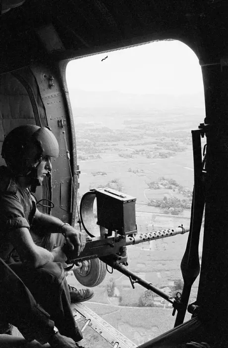 Framed Print : Machine Gunner in Helicopter Over Vietnam