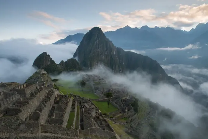 Framed Print : Machu Picchu at Sunrise with rolling fog and clouds