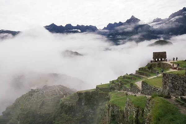 Machu Picchu surrounded by fog, Peru