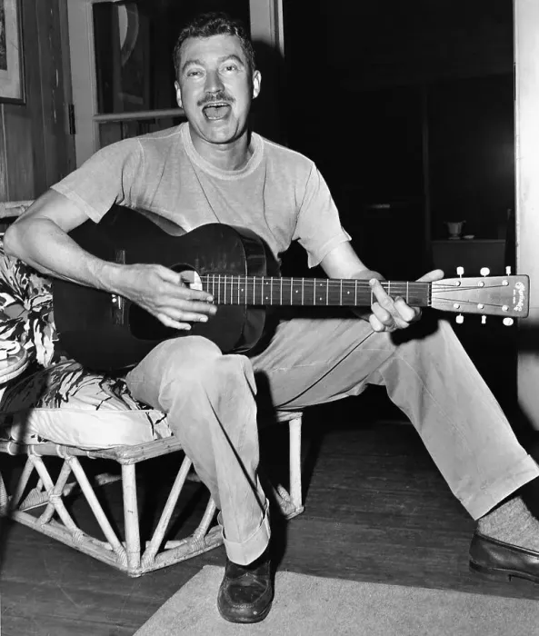 Framed Print : MacKinlay Kantor Singing and Playing Guitar Framed Print : MacKinlay Kantor Singing and Playing Guitar