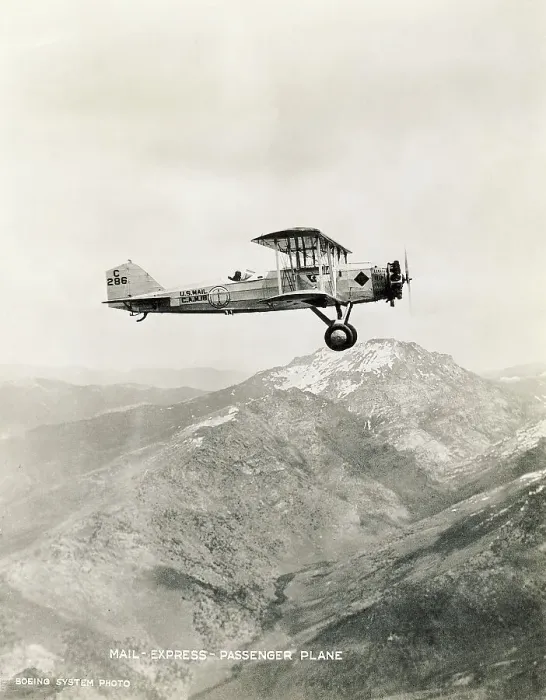 Framed Print : Mail Biplane Flying over Mountains Framed Print : Mail Biplane Flying over Mountains