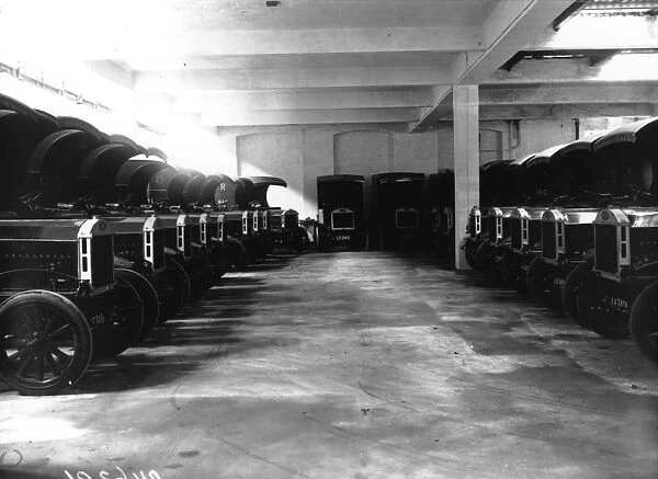 Mail Vans. July 1912: Lines of identical mail vans in a garage in Shoreditch
