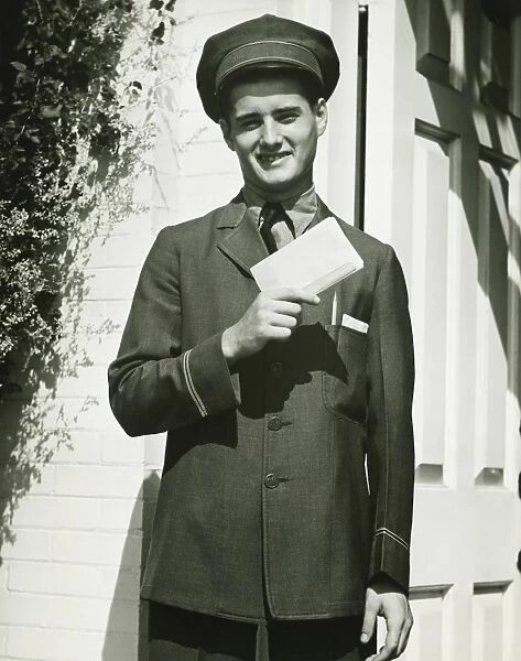 Mailman holding blank form outdoors, (B&W), portrait