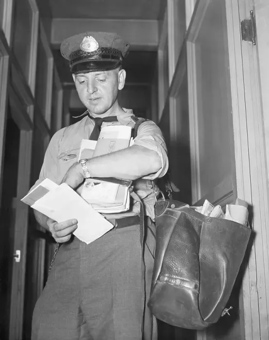 Framed Print : Mailman Looking at Watch Framed Print : Mailman Looking at Watch
