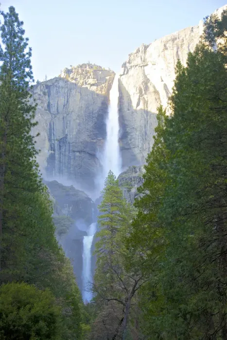 Framed Print : Majestic waterfall with tall trees, cliff and blue sky Framed Print : Majestic waterfall with tall trees, cliff and blue sky