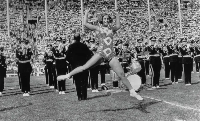 Framed Print : Majorette Mid Jump During Band Performance
