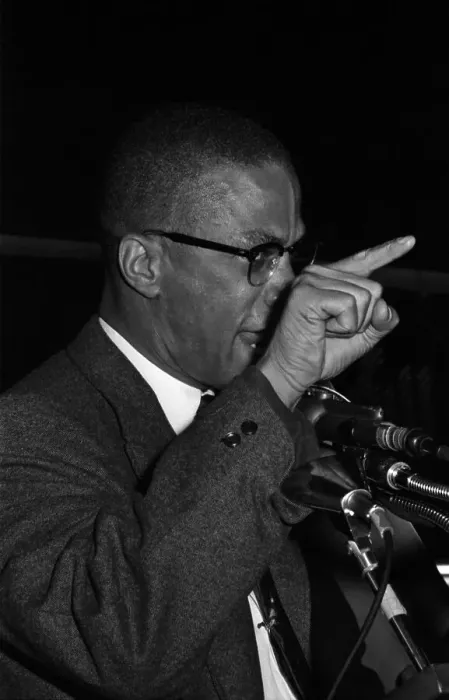 Framed Print : Malcolm X. Black Muslim minister Malcolm X has assistant hold picture of Framed Print : Malcolm X. Black Muslim minister Malcolm X has assistant hold picture of