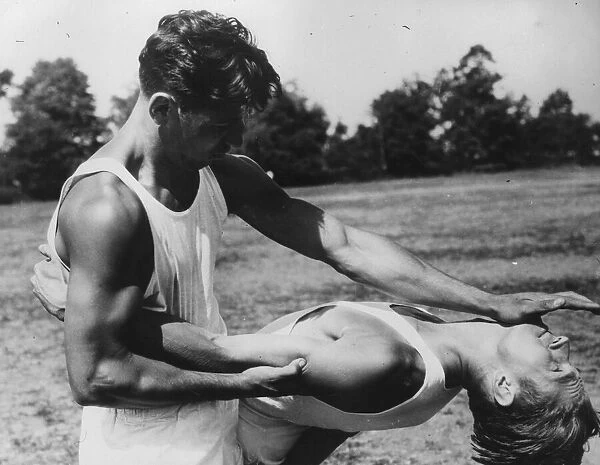 Judo. circa 1930: Two male adults practicing Judo outside