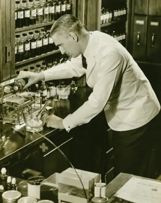 Framed Print : Male pharmacist working in laboratory, (B&W), (Elevated view) Framed Print : Male pharmacist working in laboratory, (B&W), (Elevated view)