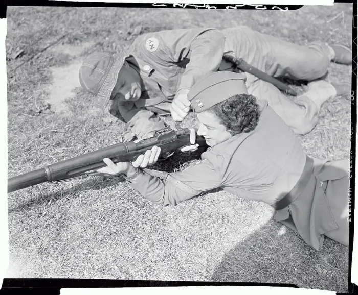 Framed Print : Male Soldier Teaching Weapon Techniques to Female Officer Framed Print : Male Soldier Teaching Weapon Techniques to Female Officer