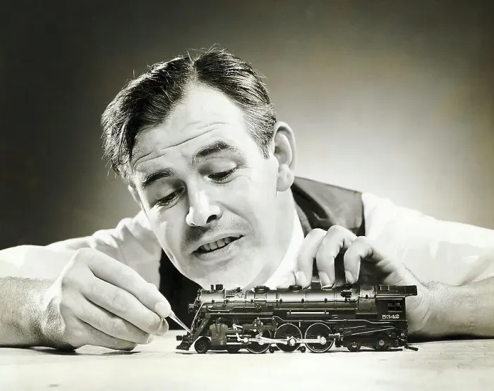 Framed Print : Man Adjusting Model Train W / Tweezer Framed Print : Man Adjusting Model Train W / Tweezer