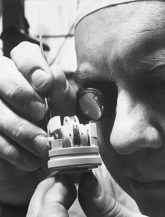 Framed Print : Man Adjusting Small Gyroscope Framed Print : Man Adjusting Small Gyroscope
