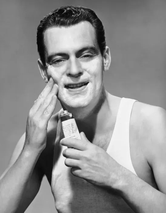 Framed Print : Man applying lotion Framed Print : Man applying lotion