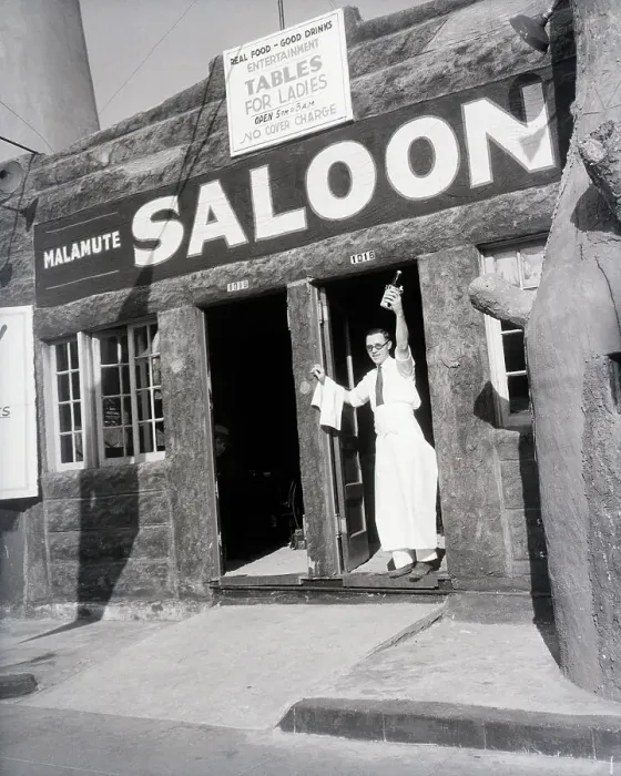 Framed Print : Man With Bottle In Door Of Malemute Salo Framed Print : Man With Bottle In Door Of Malemute Salo