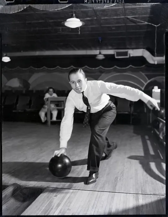 Framed Print : Man Bowling in Tie Framed Print : Man Bowling in Tie