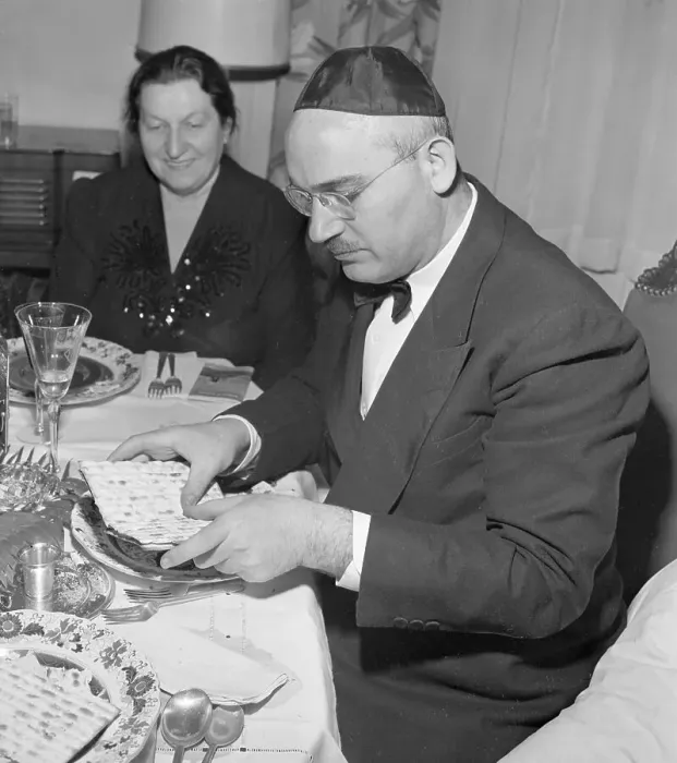 Framed Print : Man Breaks Matzoh for Passover Framed Print : Man Breaks Matzoh for Passover