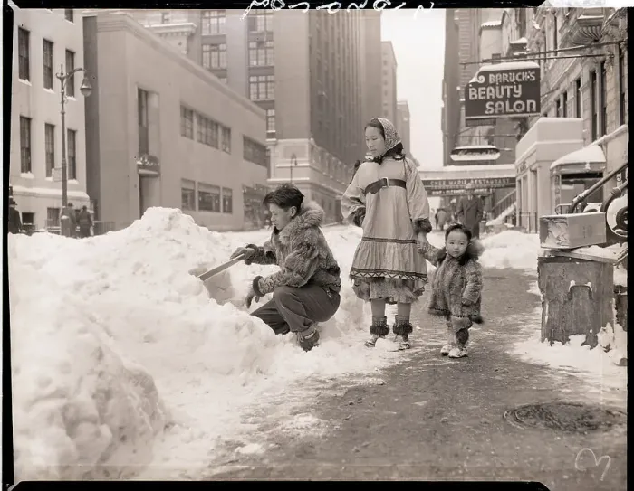 Framed Print : Man Building Snow Hut on Street Framed Print : Man Building Snow Hut on Street