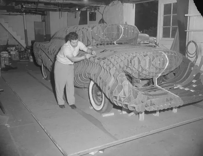 Framed Print : Man Building a Sports Car Prototype Model Framed Print : Man Building a Sports Car Prototype Model