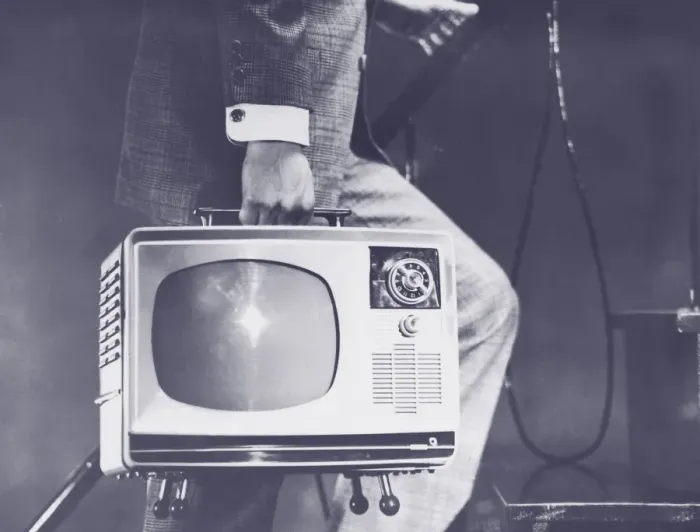 Framed Print : Man carrying portable television up steps, low section (B&W) Framed Print : Man carrying portable television up steps, low section (B&W)