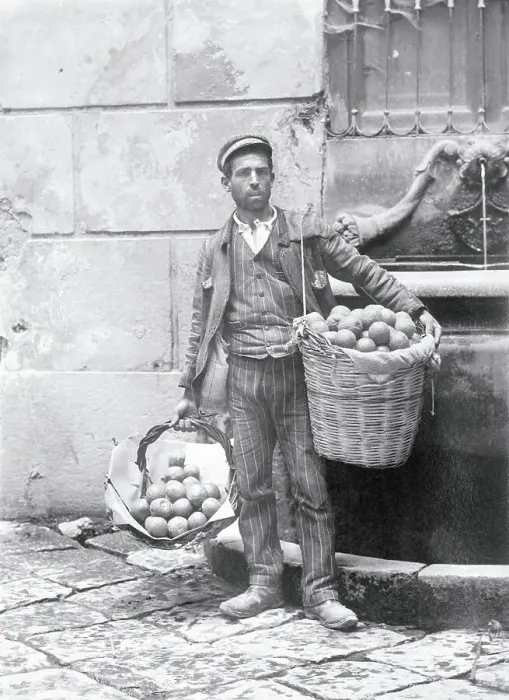 Framed Print : Man Carrying Produce for Sale Framed Print : Man Carrying Produce for Sale