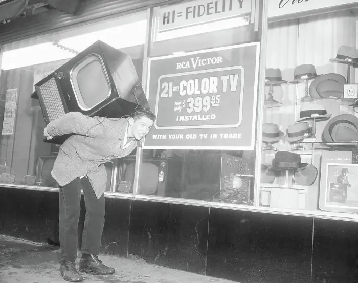 : Man Carrying Television On Back : Man Carrying Television On Back