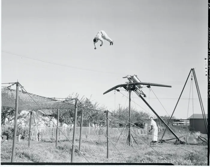 Framed Print : Man Being Catapulted Through the Air Framed Print : Man Being Catapulted Through the Air