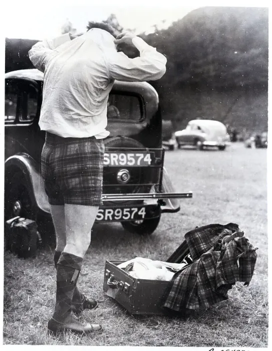 Framed Print : Man Changing Out Of Kilt Framed Print : Man Changing Out Of Kilt