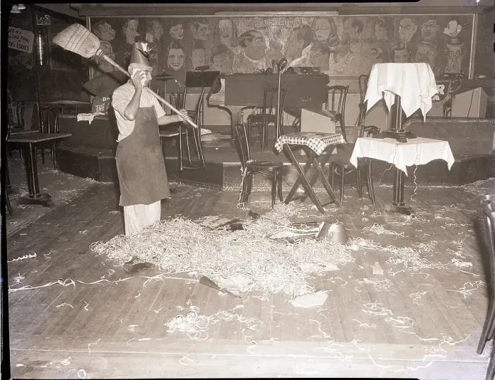 Framed Print : Man Cleaning Up After A New Years Party Framed Print : Man Cleaning Up After A New Years Party