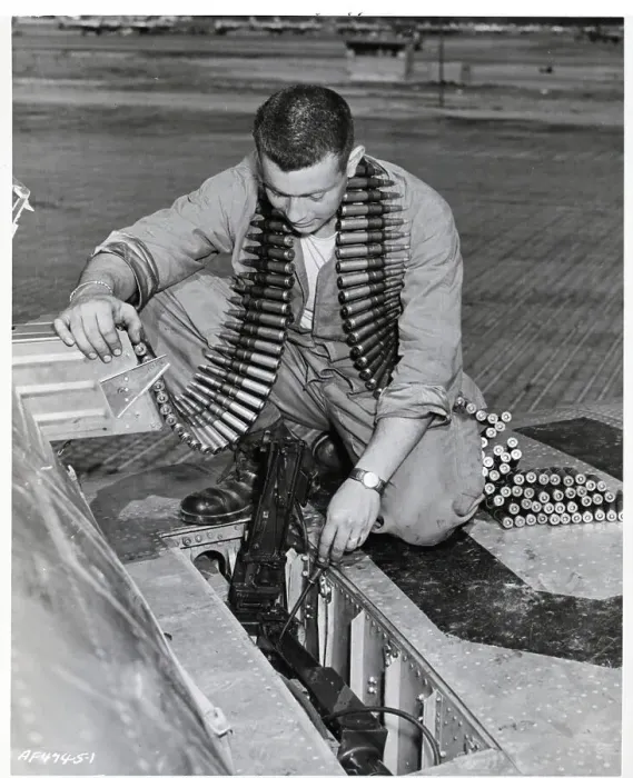Framed Print : Man Cleans & Checks Machine Guns Framed Print : Man Cleans & Checks Machine Guns