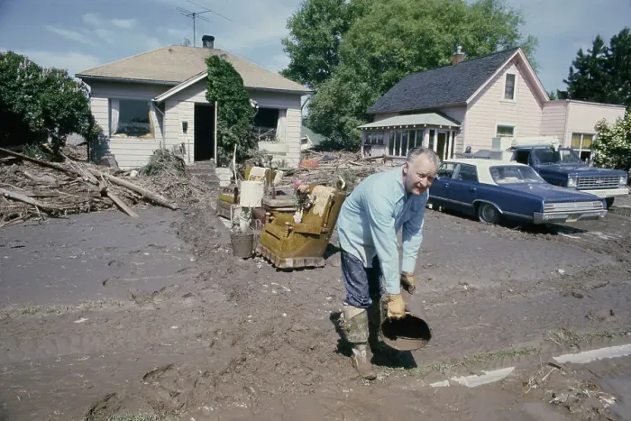 Framed Print : Man Clearing Mud Framed Print : Man Clearing Mud