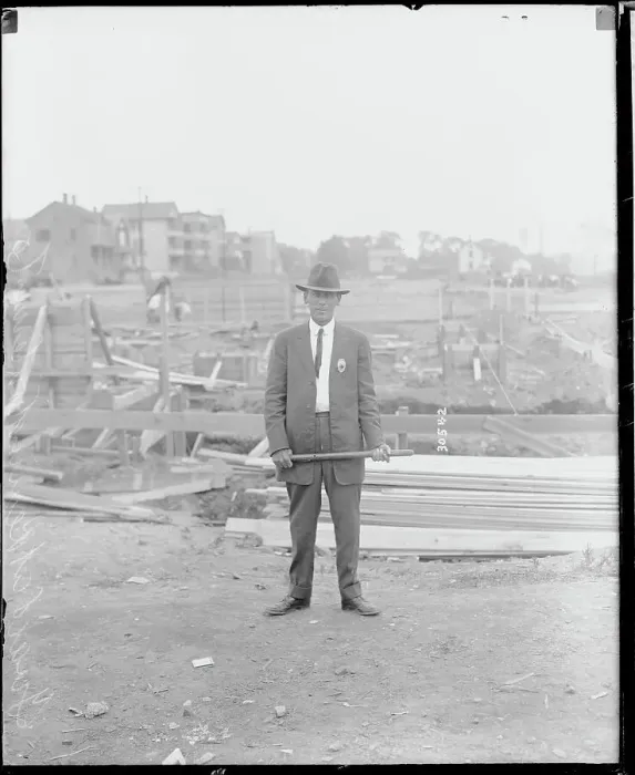 Framed Print : Man with Club Guarding Factory Framed Print : Man with Club Guarding Factory