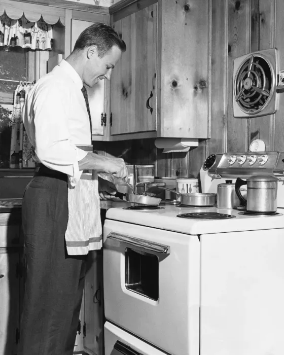 Framed Print : Man cooking at stove Framed Print : Man cooking at stove