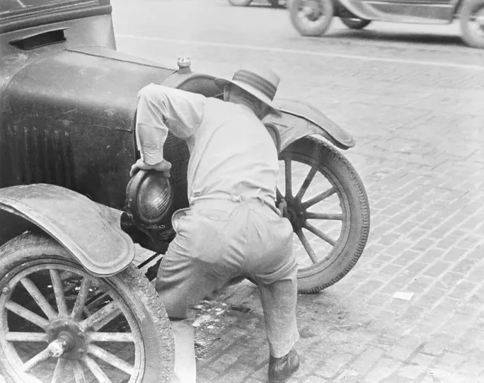 Framed Print : Man Cranking Car Framed Print : Man Cranking Car
