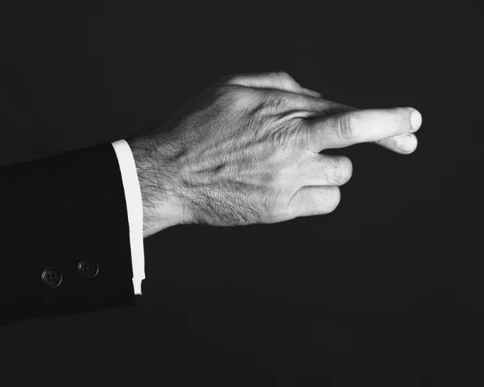 Framed Print : Man crossing fingers in studio, (B&W), close-up Framed Print : Man crossing fingers in studio, (B&W), close-up